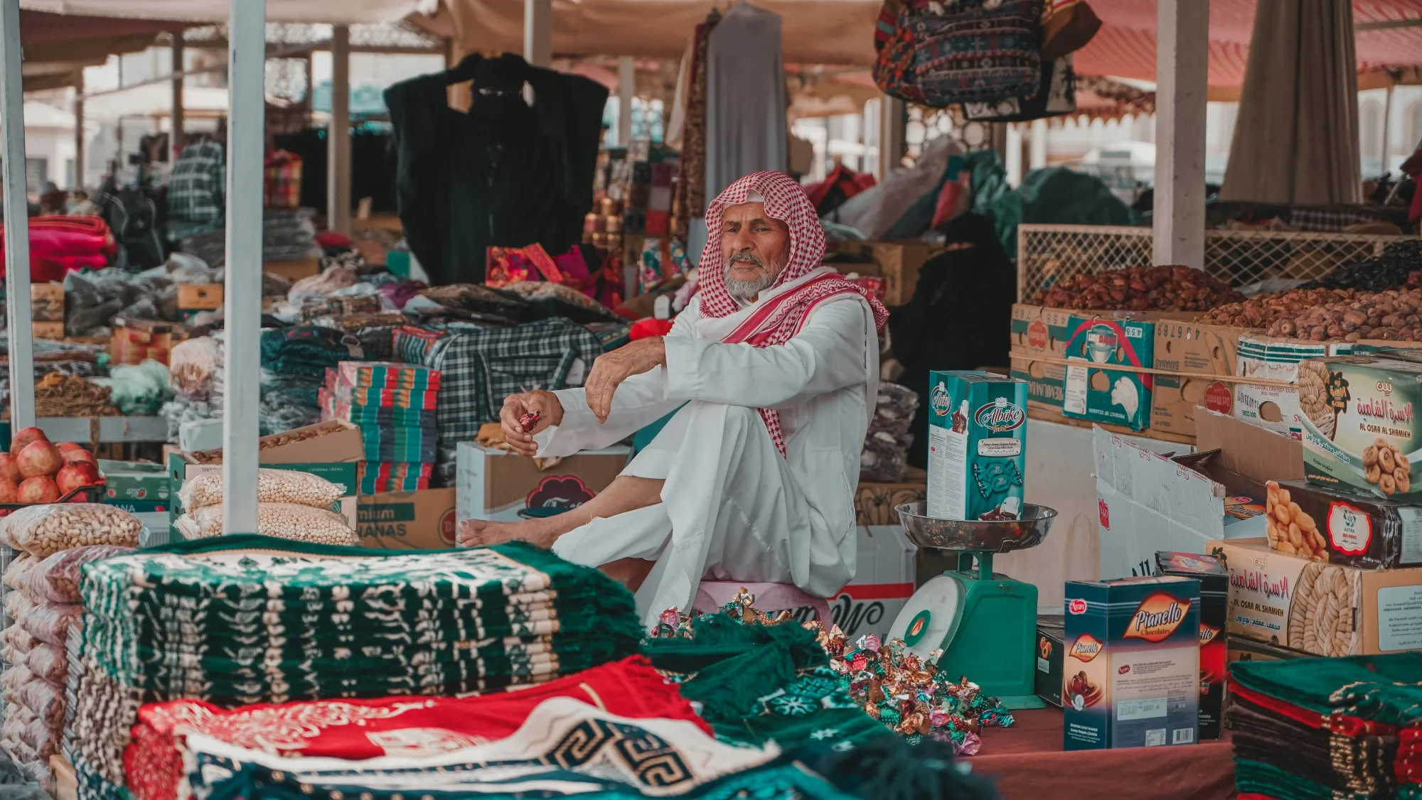 Colourful trays of Ajwa and other dates at a market in Madinah